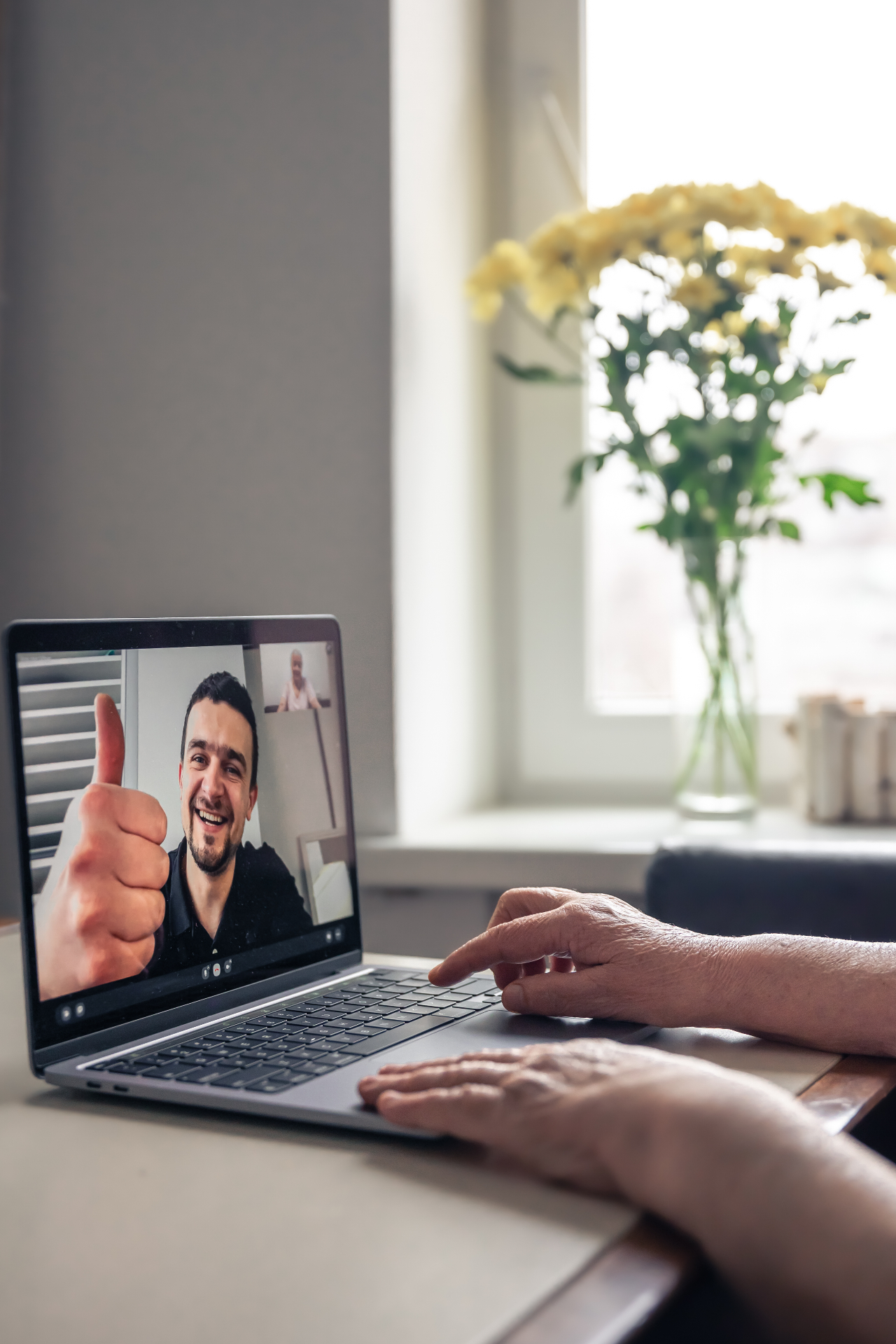Mentor giving a thumbs up on a video call