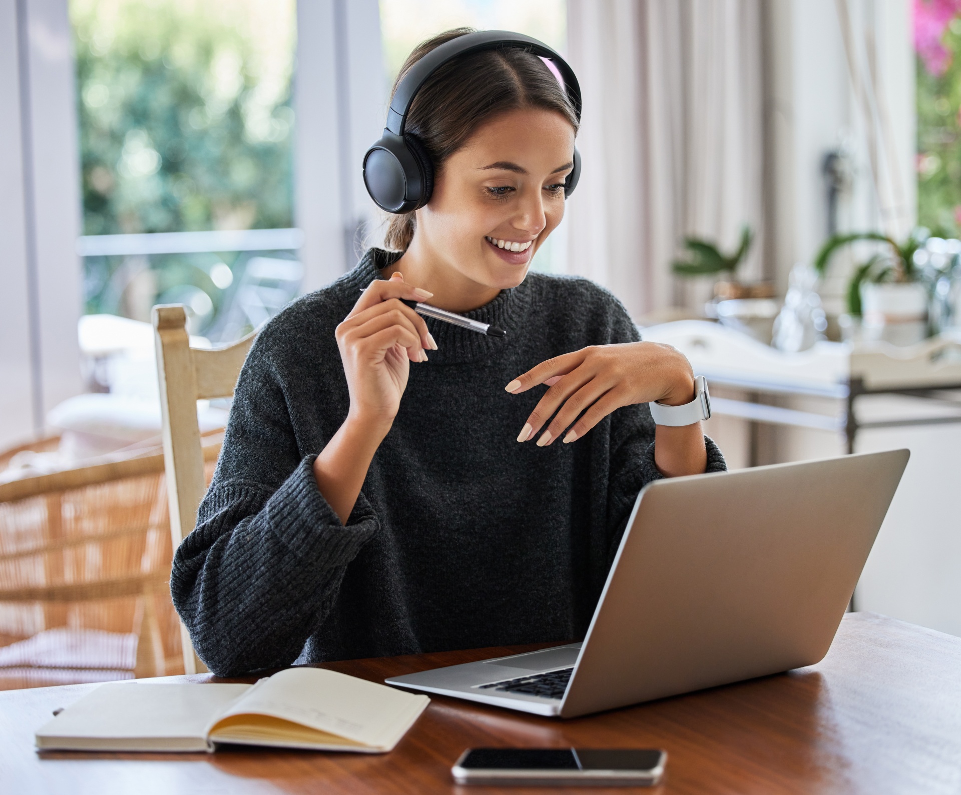 Learner smiling while studying an online program