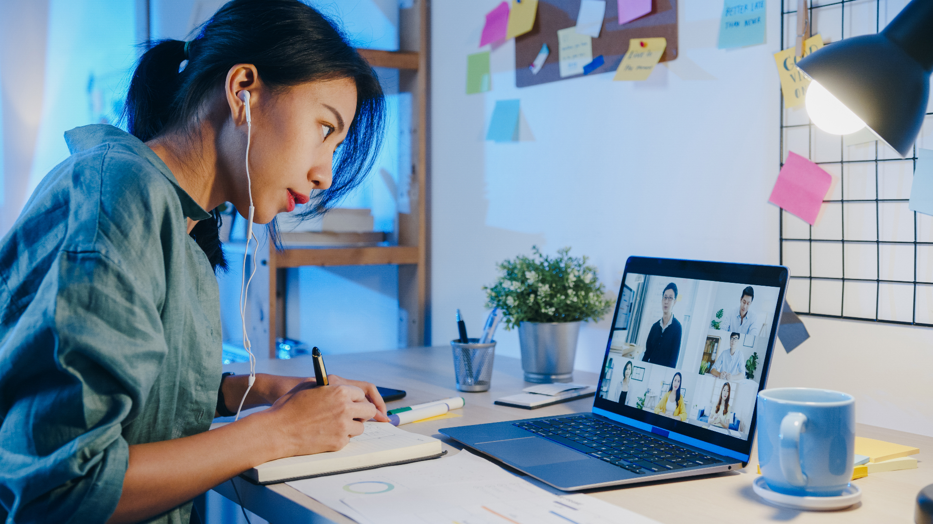 Learner taking notes during a live video session